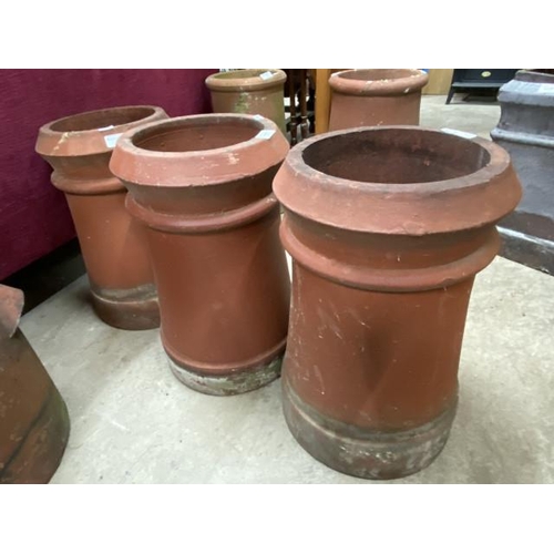 230 - 3 terracotta chimney pots/planters 46H 28cm diameter