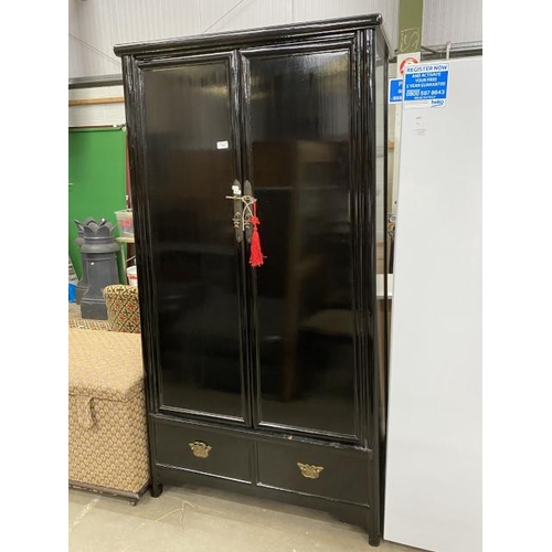 31 - Oriental black lacquered 2 door cupboard with shelves to the interior 185H 93W 52D