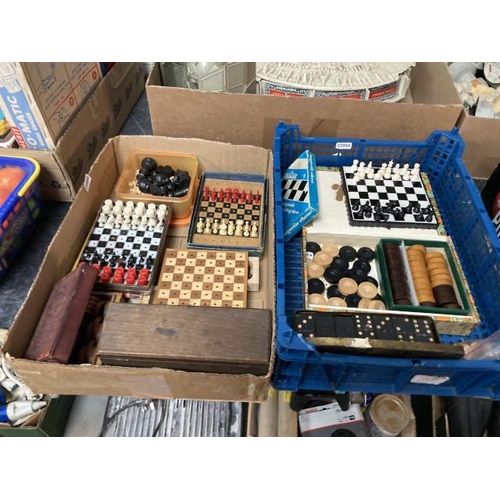 381 - 2 boxes of vintage chess pieces, dominoes, checkers pieces, travel chess sets etc.