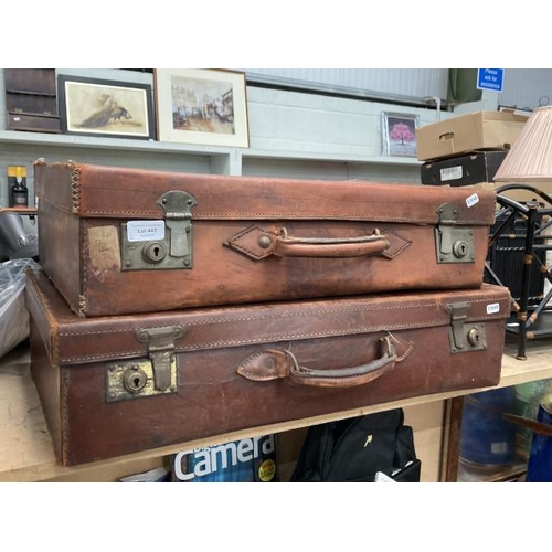 445 - 2 antique leather travel cases with French exportation stickers