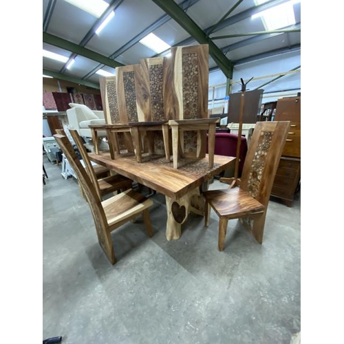 91 - Indonesian teak dining table with a branch coin design to the centre 78H 216W 110D and 10 teak high ... 