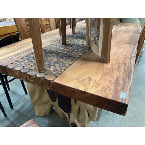 91 - Indonesian teak dining table with a branch coin design to the centre 78H 216W 110D and 10 teak high ... 