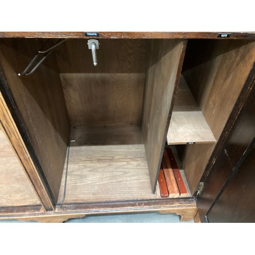 100 - Waring & Gillow Ltd oak fitted wardrobe with shelves and hanging rail to the interior 182H 133W 54D ... 