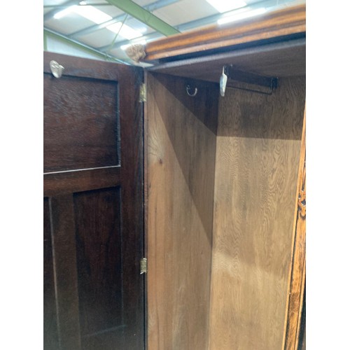 100 - Waring & Gillow Ltd oak fitted wardrobe with shelves and hanging rail to the interior 182H 133W 54D ... 