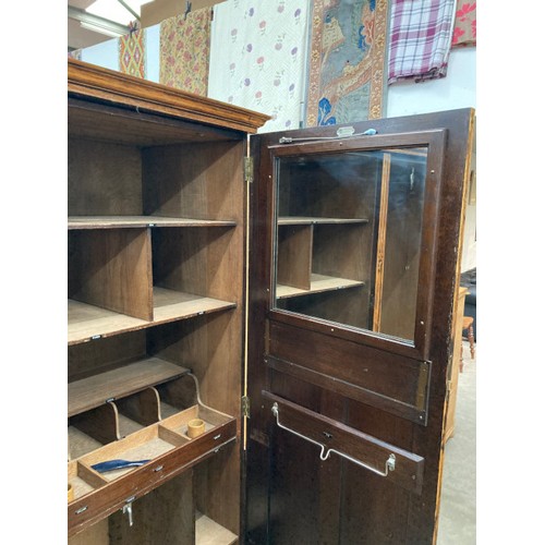 100 - Waring & Gillow Ltd oak fitted wardrobe with shelves and hanging rail to the interior 182H 133W 54D ... 