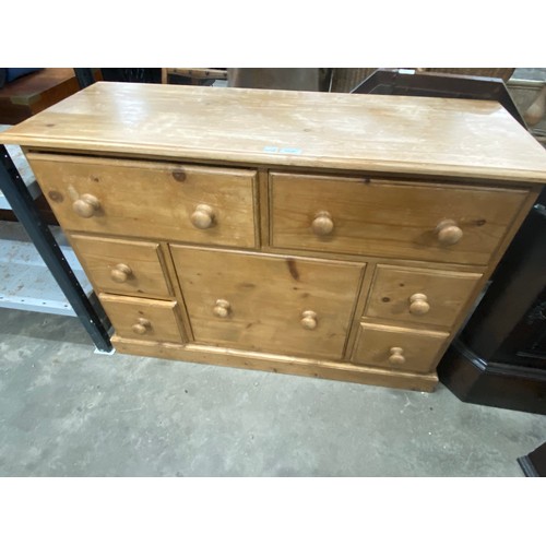 201 - Pine multi drawer chest 76H 109W 40D