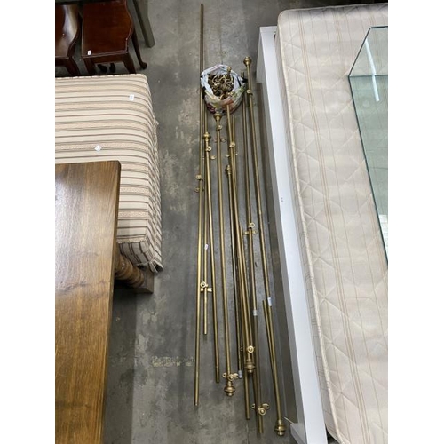 56 - Assorted brass curtain poles and finials in various sizes