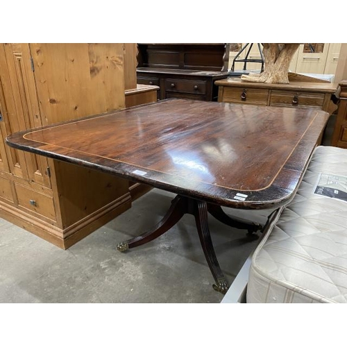 70 - Regency mahogany cross banded dining table on a centre pedestal 74H 142W 110D