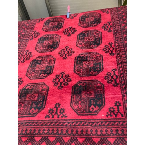 149 - Red ground Persian rug 245 x 165cm