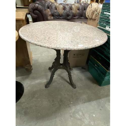 231 - Marble topped table on a cast base 74H 90cm diameter