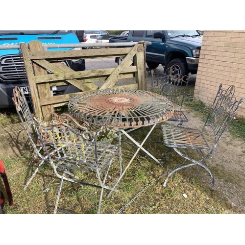 537 - Antique French metal garden table 78H 100cm diameter and 4 metal chairs