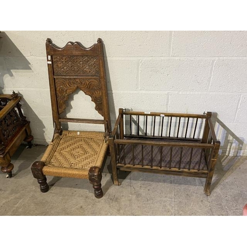 94 - Early 20th century Tibetan carved oak meditation chair and a Victorian oak dolls crib