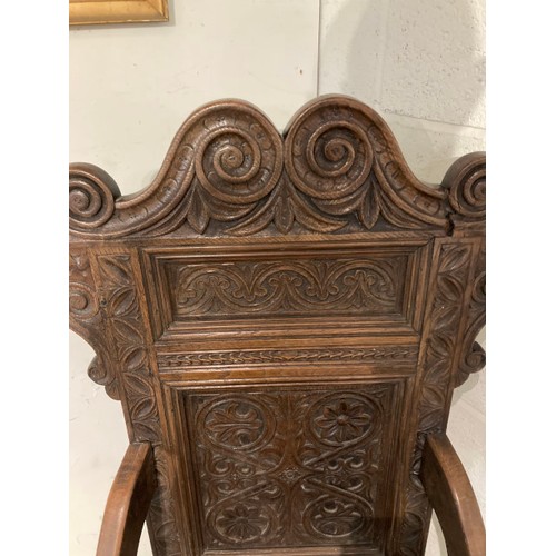 129 - 17th century style carved oak 'Wainscot' armchair 128H 63W 58D