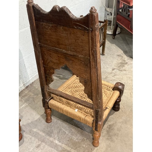 94 - Early 20th century Tibetan carved oak meditation chair and a Victorian oak dolls crib