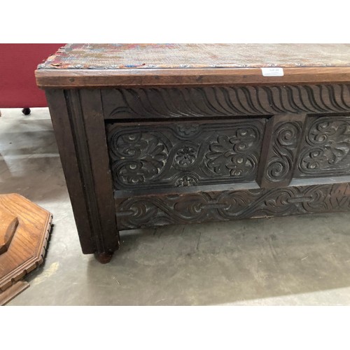 28 - Early carved oak blanket box (inscribed 16M11 WB) 47H 133W 41D (top requires attention)