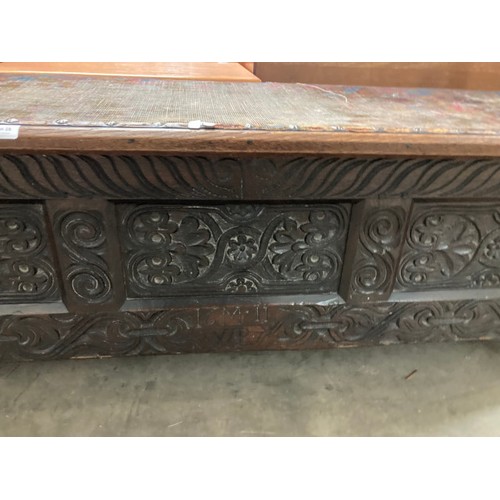 28 - Early carved oak blanket box (inscribed 16M11 WB) 47H 133W 41D (top requires attention)