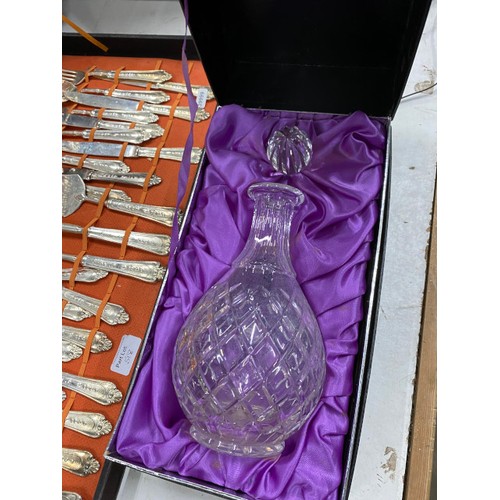 518 - Boxed Edinburgh Crystal decanter and a boxed set of Italian silver plated cutlery (64 pieces, box as... 