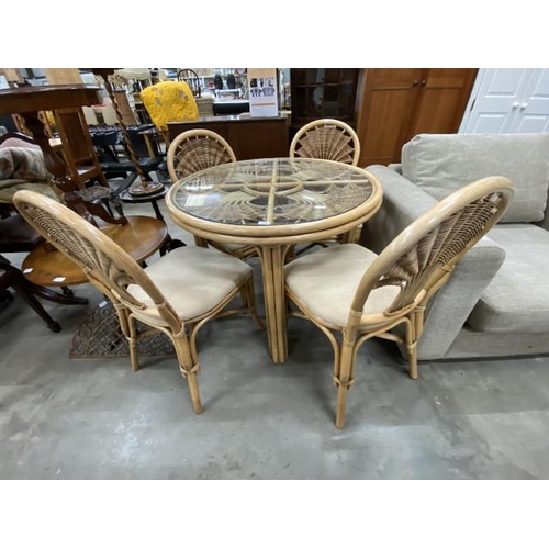 145 - Burdekin rattan table 73H 97cm diameter and 4 chairs