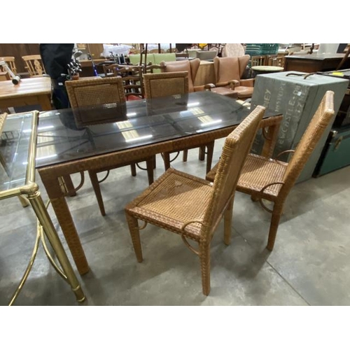 25 - Contemporary rattan and cane dining table (as found) 77H 92W 151D and 4 chairs