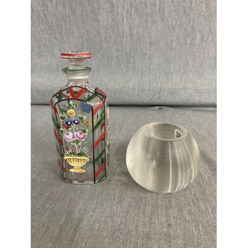 324 - Antique hand enamelled scent bottle and an antique ribbed solid glass match striker