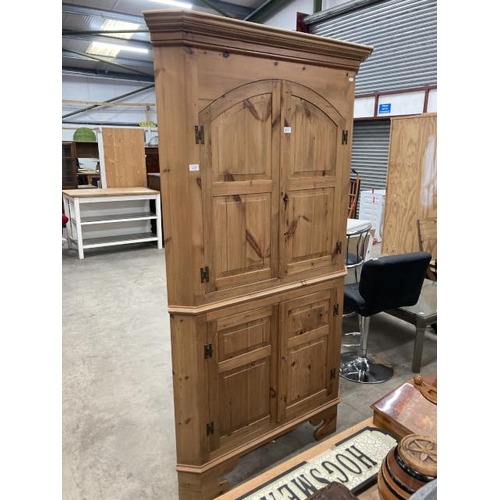 489 - Pine 4 door corner cupboard 200H 110W 61D with shelves to the interior