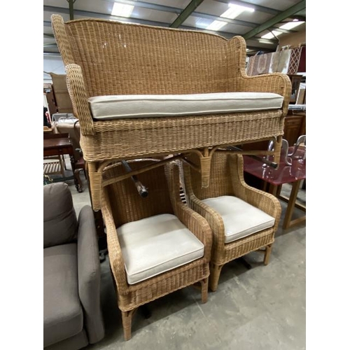 52 - Good quality wicker three piece suite with seat cushions in cream (settee 92H 125W 65D and two armch... 