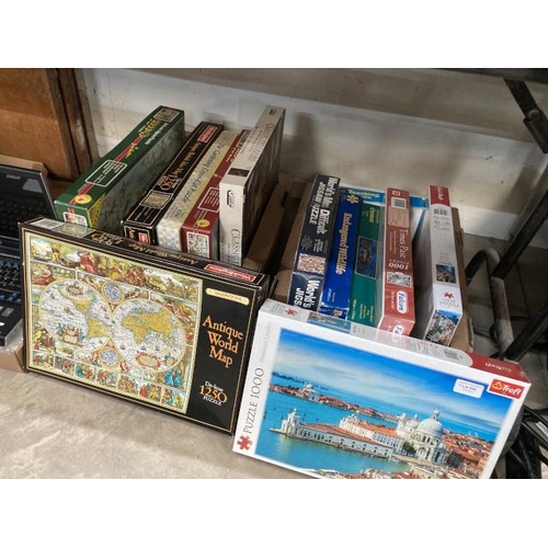 520 - 12 boxes of assorted jigsaws including Waddington's Antique World Map, The Garden Cross Cut puzzle, ... 