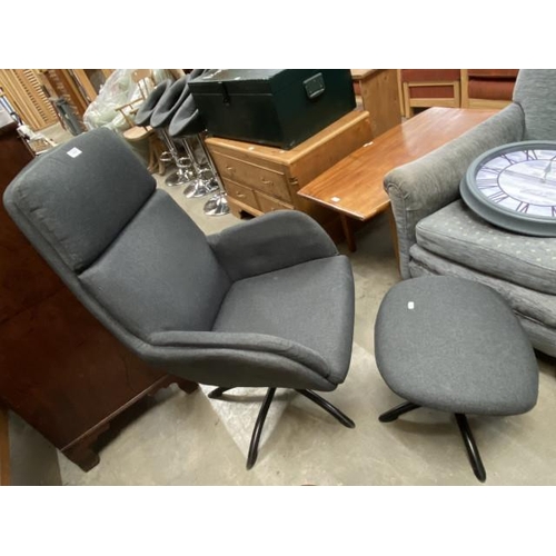 33 - Grey upholstered swivel lounge chair 111H 70W 60D and a matching footstool