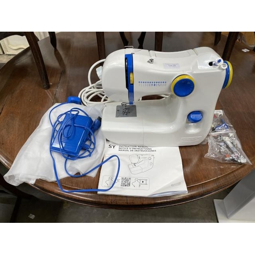 39 - Ikea E1001 sewing machine with foot pedal and accessories