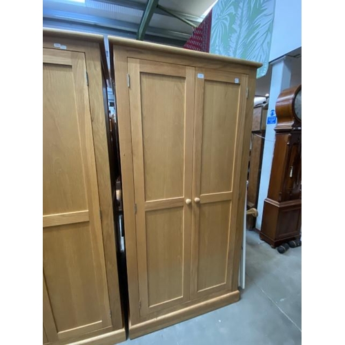 57 - Good quality oak two door wardrobe with hanging rail and shelf to the interior 188H 96W 57D