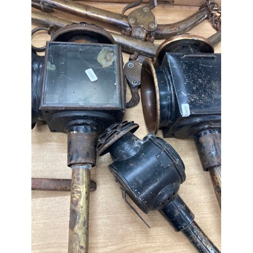 554 - Pair of vintage brass hames, 3 vintage coaching lamps and one other, 4 vintage spanners etc