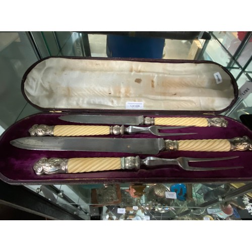 428 - Cased 4 piece Joseph Rodgers & Sons bone & silver tipped carving set (One fork as seen)