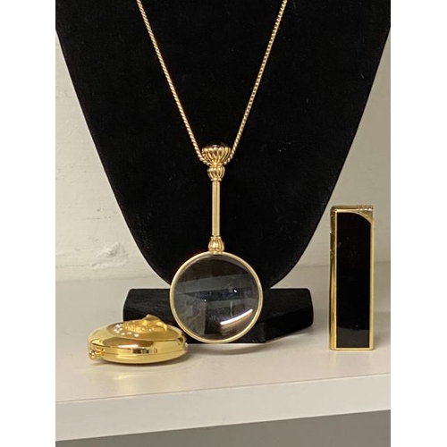 305 - Colibri Molectric lighter, Estee Lauder powder compact & a gem set magnifying pendant on neck chain,... 