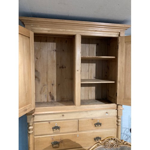 153 - Victorian pine press with two doors over four drawers (shelves to the interior) 226H 150W 64D