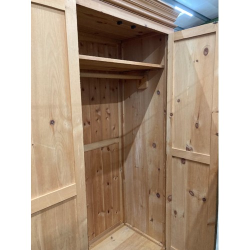 86 - Pine two door wardrobe with hanging rail to the interior 205H 99W 60D