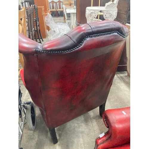 57 - Pair of ox blood leather button back Chesterfield wing armchairs 110H 87W 90D (both sold as seen)