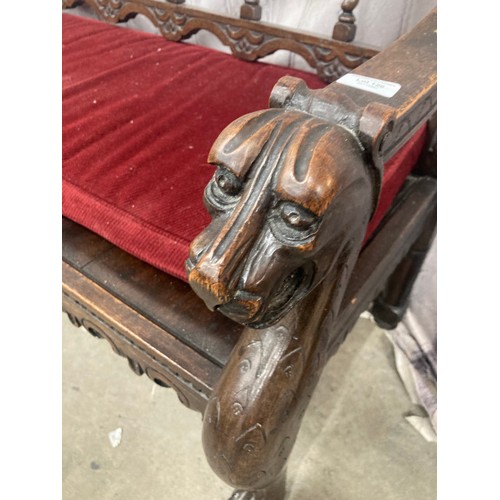 126 - Victorian carved oak hall bench with lions head carved armrests 105H 136W 56D