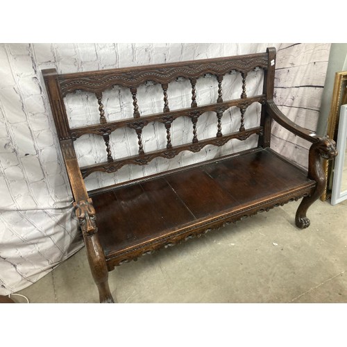 126 - Victorian carved oak hall bench with lions head carved armrests 105H 136W 56D