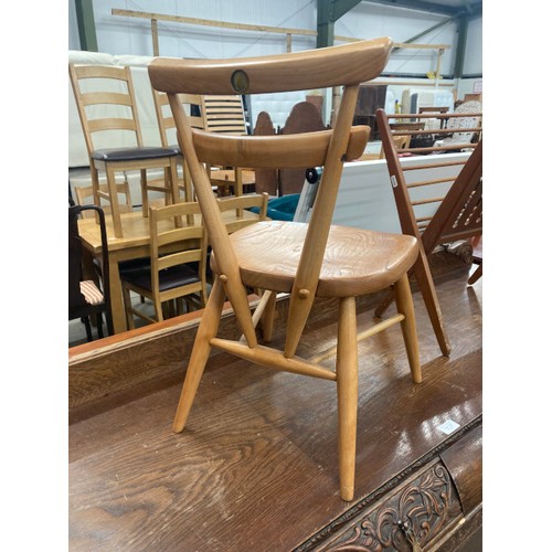 130 - Ercol stacking child's chair with solid elm seat and beech legs and back rest (missing the Ercol lab... 