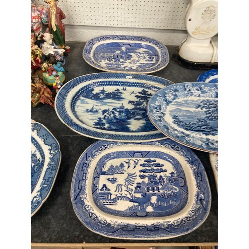 335 - 14 large antique blue and white meat plates including Georgian (some as found)