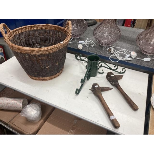 390 - 2 vintage millstone dressing tools, metal Christmas tree stand and a wicker log basket 37H 52 DIAM