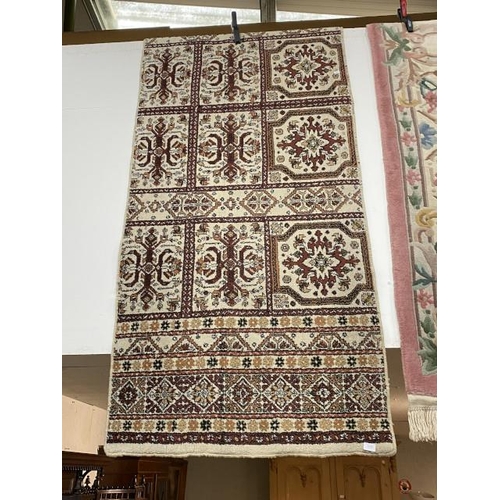 62 - Cream ground Persian style rug 95 x 280cm