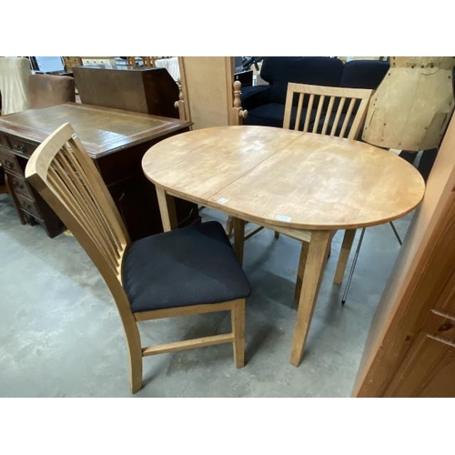 87 - Oak draw leaf kitchen table 75H 107W 80-136D and 2 chairs