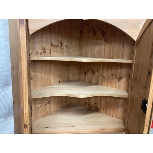 11 - Pine four door corner cupboard with shelves to the interior 200H 110W 61D