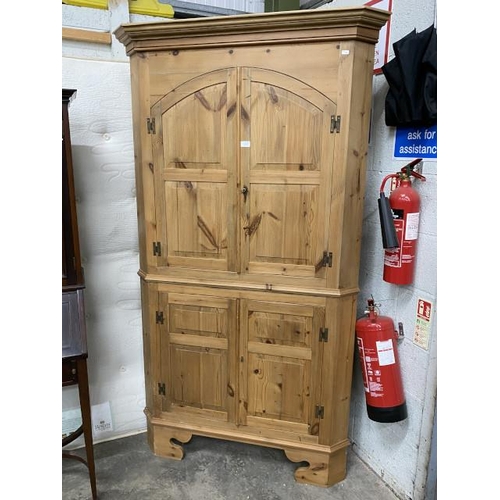 11 - Pine four door corner cupboard with shelves to the interior 200H 110W 61D