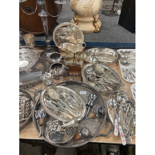 476 - Nice collection of silver plate including 2 candelabras 28 and 49H, 3 galleried trays, goblets, suga... 