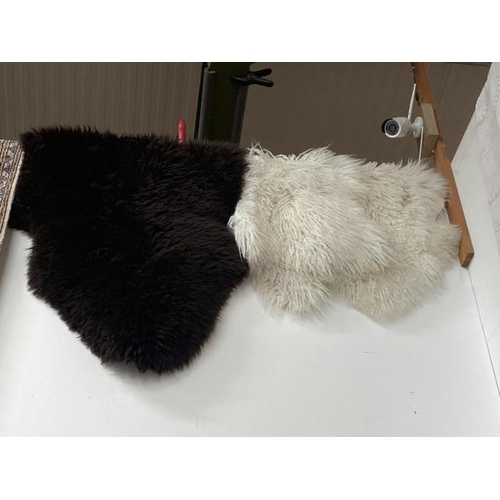 562 - Three genuine sheepskin rugs,  Marks & Spencer 106 x 75cm and 2x 100 x 64cm