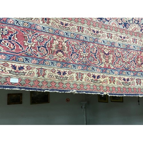 112 - Burgundy and blue ground Persian rug 390 x 325cm (worn - sold as seen)