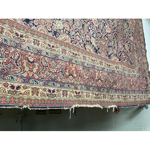 112 - Burgundy and blue ground Persian rug 390 x 325cm (worn - sold as seen)