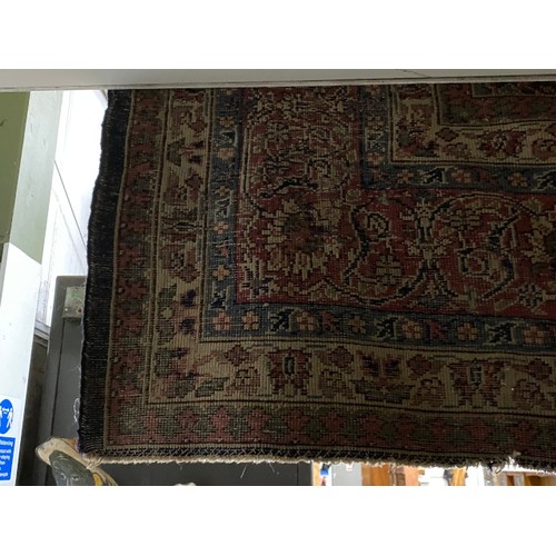 112 - Burgundy and blue ground Persian rug 390 x 325cm (worn - sold as seen)